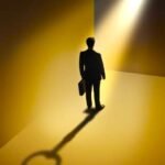 Businessman standing on shadow of key with keyhole