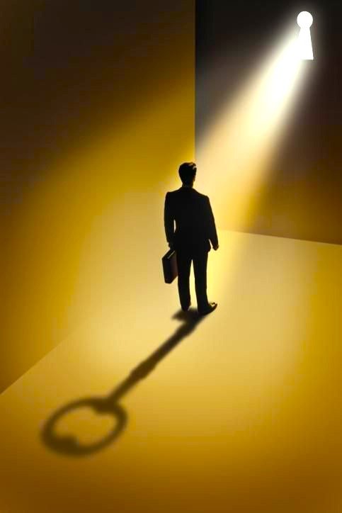 Businessman standing on shadow of key with keyhole